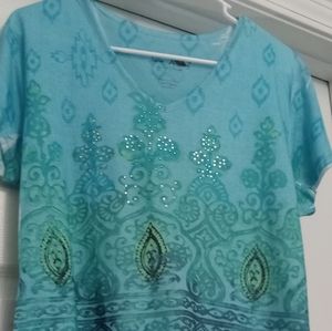 Ladies size large short sleeve top. Jane Ashley is the brand. Turquoise w/rhines